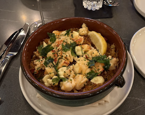 Heritage Kitchen and Cocktails signature dishes Lobster PaellaSpanish OctopusSausage and Fennel Pizza